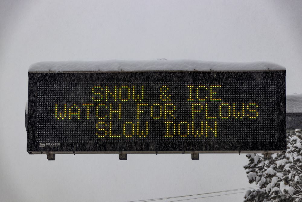 Photo of Arizona Department of Transportation snow and ice safety message on a highway sign