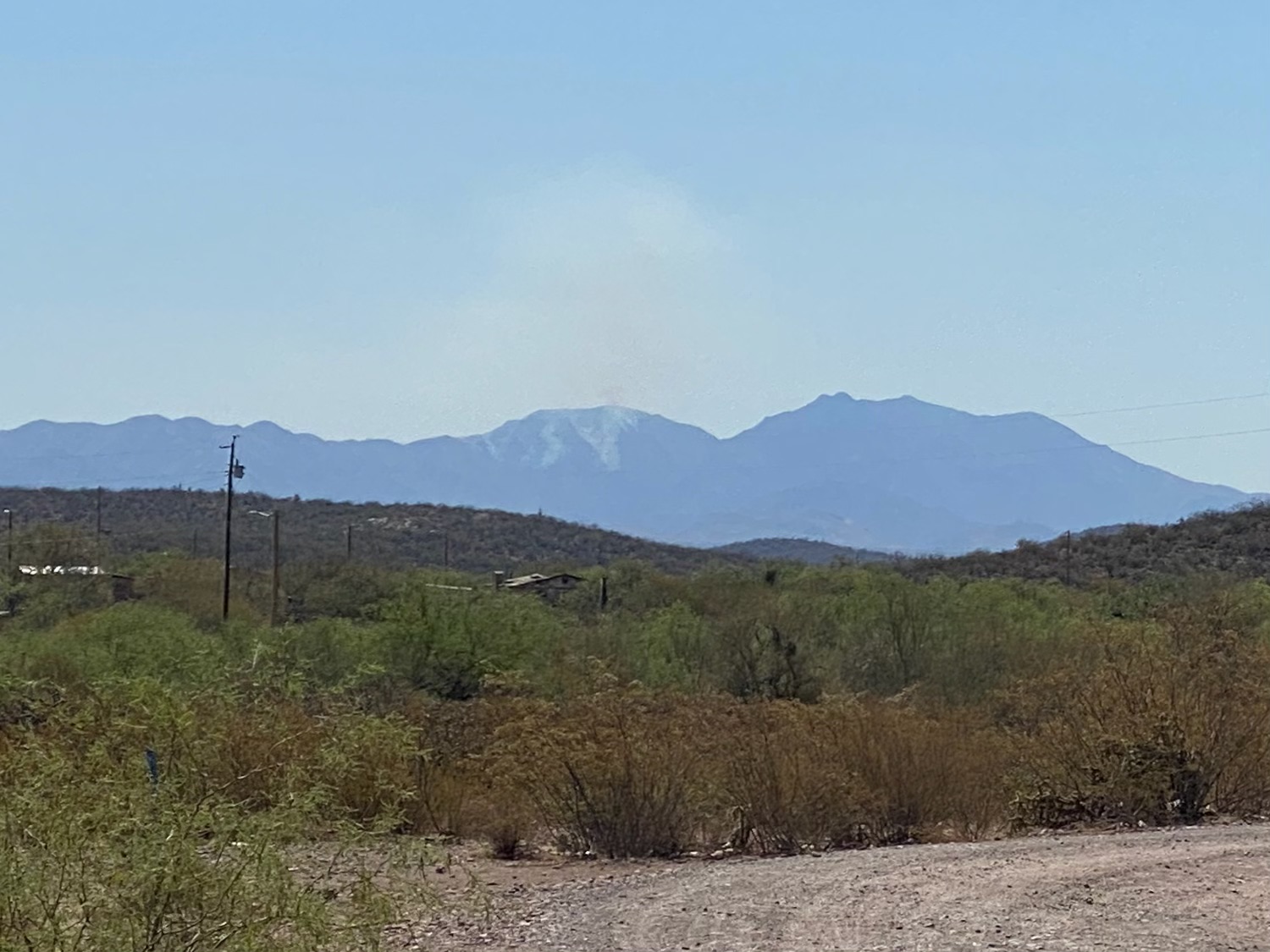 Smoke from the Contreras Wildfire is visible from the community of Sells, AZ
