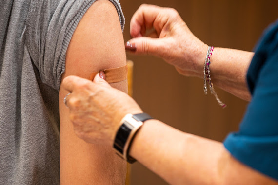 Person receives COVID-19 vaccine shot