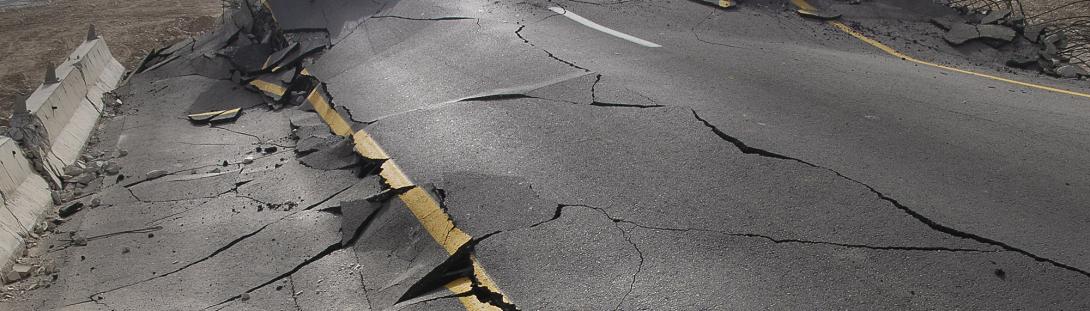 Cracked and uneven roads due to earth movement.