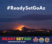 Graphic with an image of a forest fire taken at dusk. Flames are visible against a darkened sky. The text in the foreground reads “#ReadySetGoAz.” For more information visit ein.az.gov/ready-set-go. 