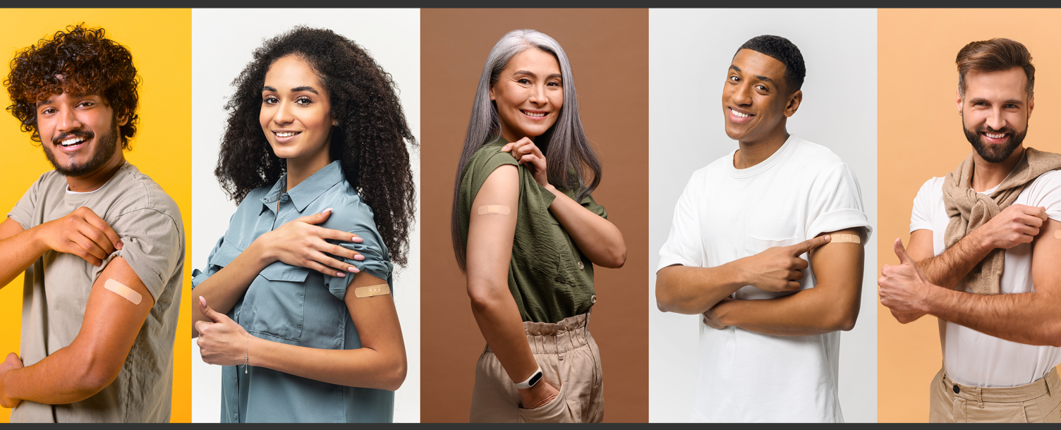 A group of diversified individuals showing off their bandaids as a symbol of getting their flu vaccination.